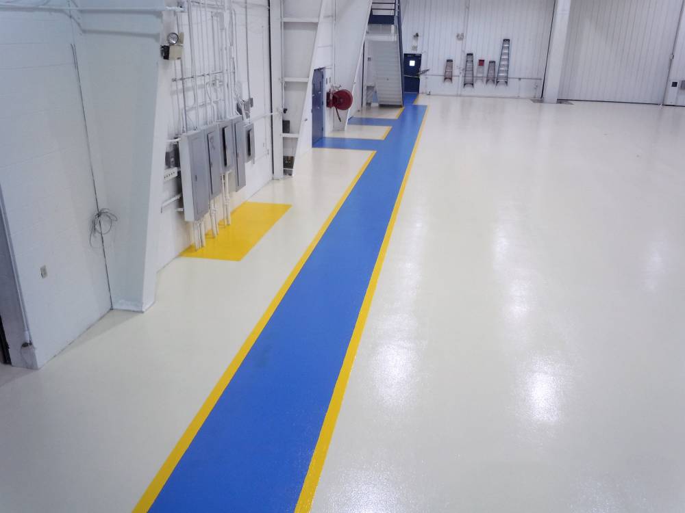 Walkways and electrical equipment are delineated in yellow and blue for safety.