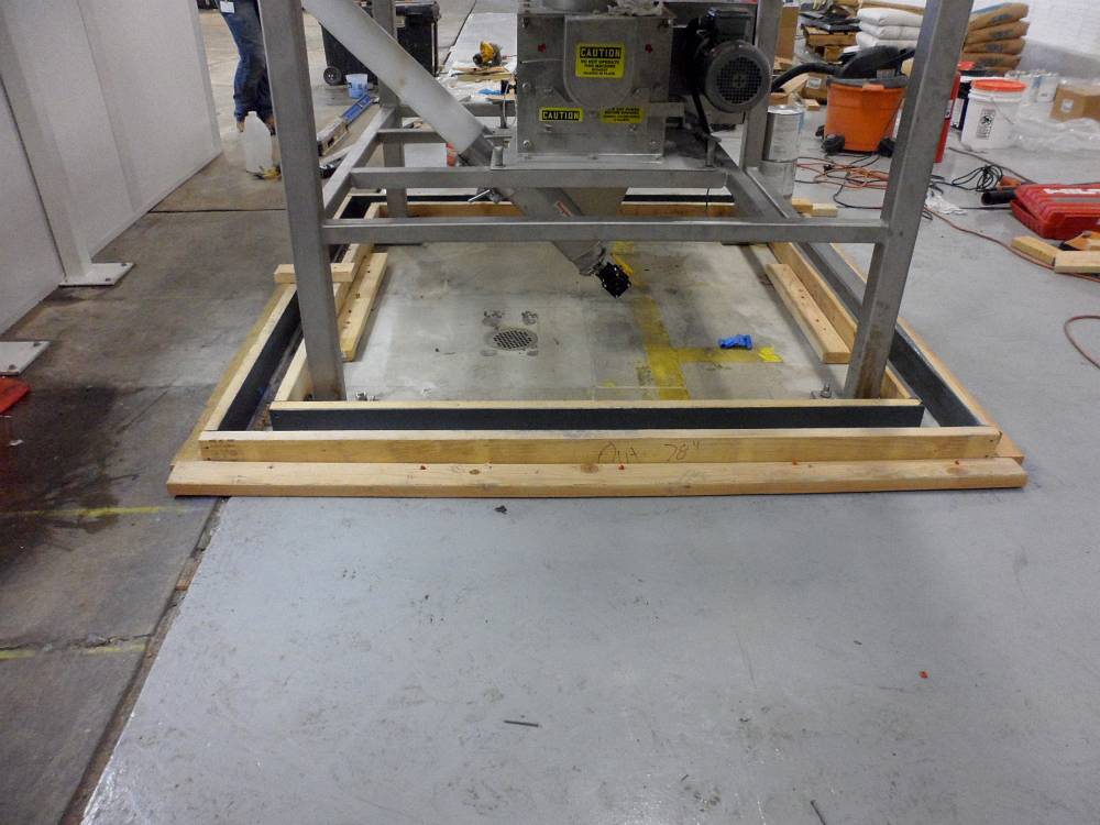 No problem for PermaFloor to construct a berm using epoxy mortar. Here the forms are ready for pouring.