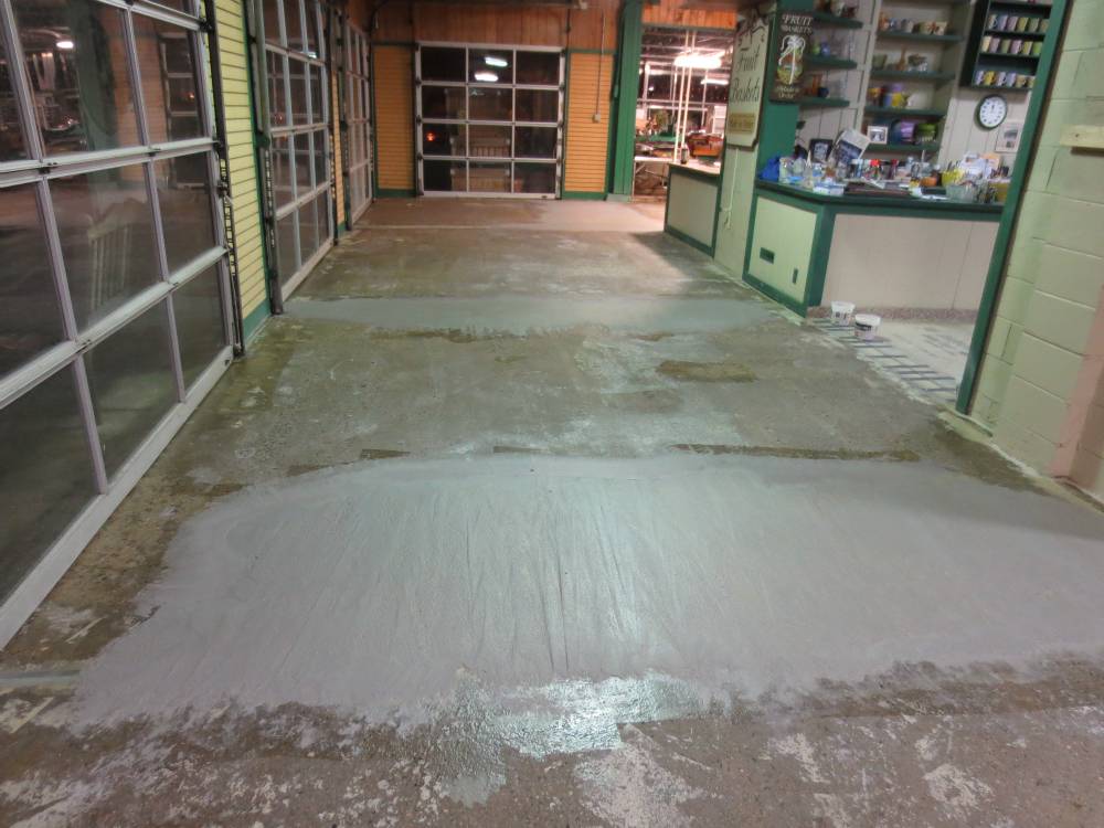 Damaged areas of concrete are patched and sloped.