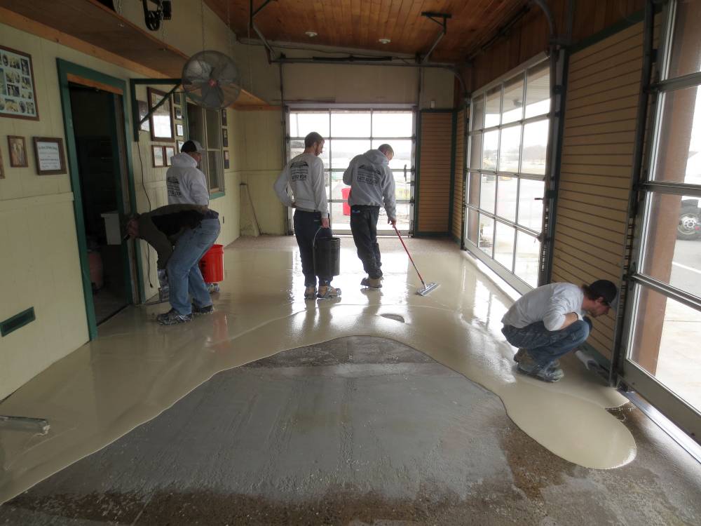 Urethane mortar is applied and decorative vinyl flakes are broadcast into the mix.