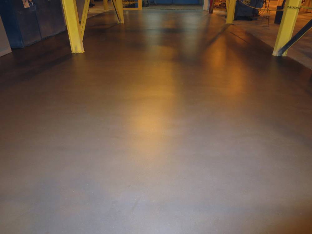 The final deck area is slip-resistant and blends nicely with the surrounding area. A gloss top coat with final satin finish was used.